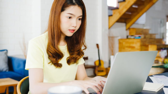 Portrait of freelance Asia women casual wear using laptop workin